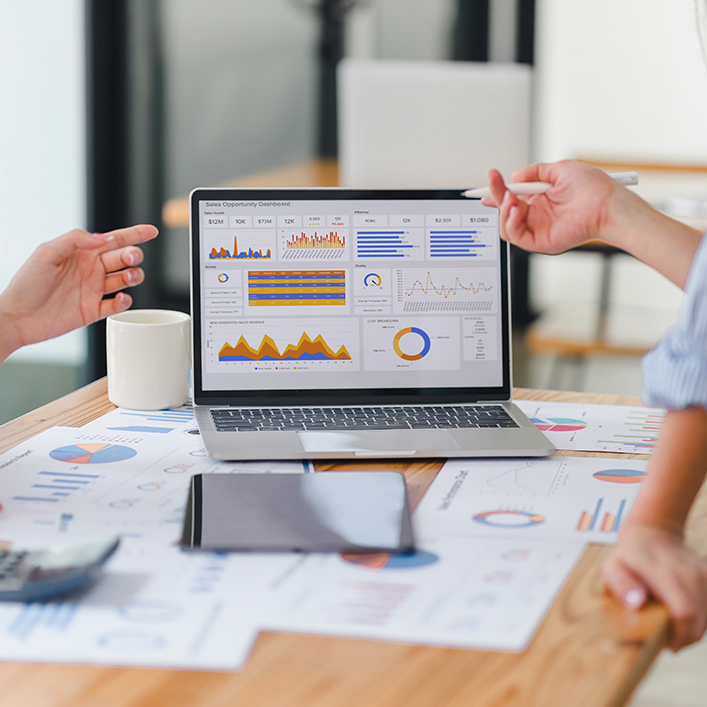 Two data analysts Working on data analysis dashboard for business strategy.